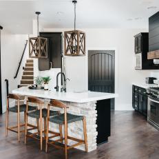 Neutral Chef Kitchen With Black Cabinets