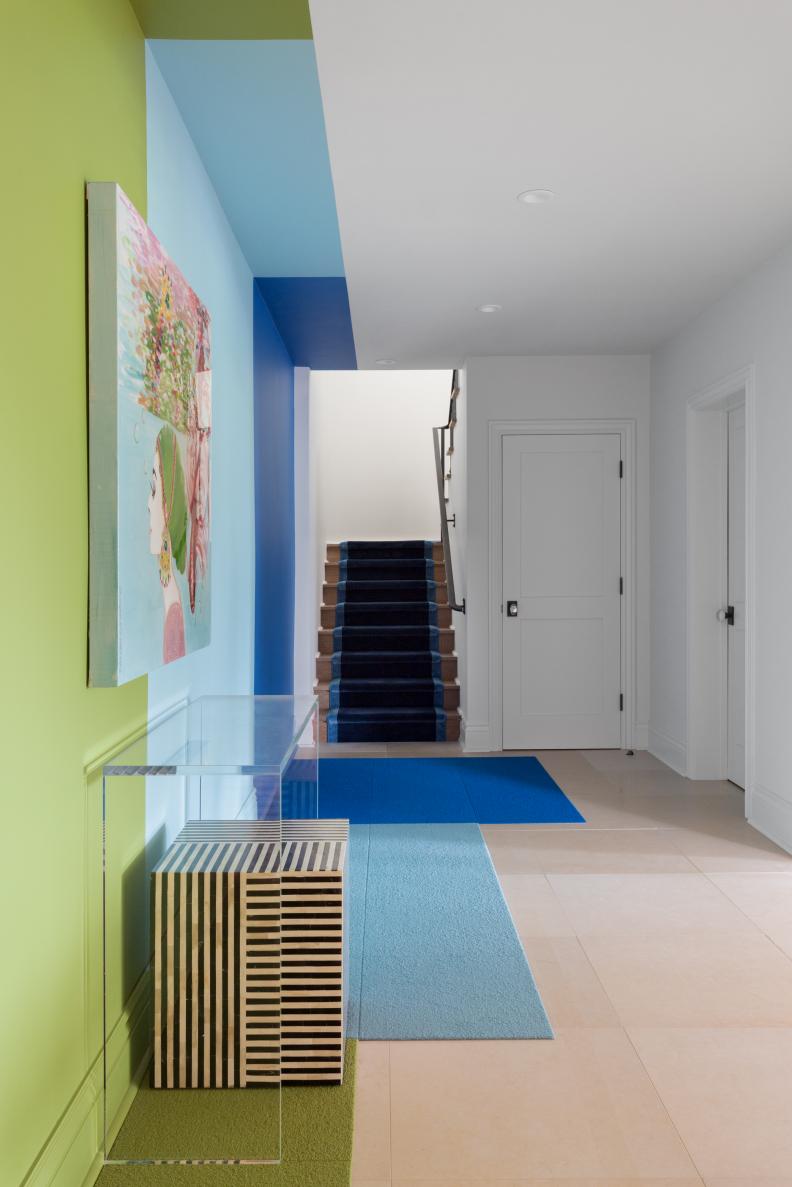 Acrylic Table in Hallway with Green, Blue Walls, Vibrant Painting