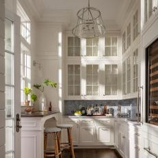 White Traditional Butler Pantry With Glass Cabinets, Wine Refrigerator and Bar Area 