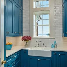 Traditional Coastal Laundry Room With Blue Cabinets 