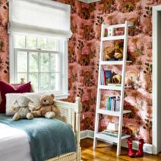 Eclectic Child's Bedroom With Pink Dinosaur Wallpaper and Ladder Storage
