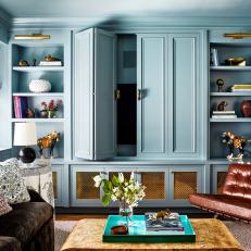 Eclectic Blue Living Room With Built-In Shelving 