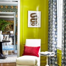 Eclectic Living Room With Acid Green Walls and White Chair