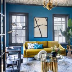 Chic Art Deco Living Room With Teal Walls and Wallpapered Ceiling