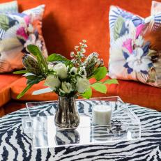 Orange Sofa and Zebra Ottoman