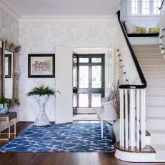 Traditional Foyer With Black Bannister