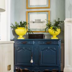 Blue Traditional Cabinet and Yellow Urns