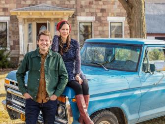 As seen on HGTV's Cheap Old Houses, hosts Ethan and Elizabeth pose for a portrait at a historical home in Gasport, NY.