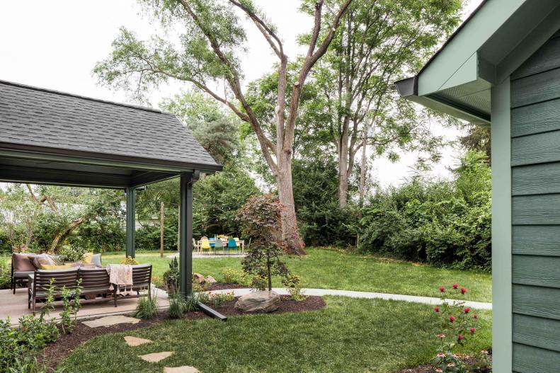 The covered outdoor seating area creates a stylish outdoor living room with plenty of space to gather with family and friends or just enjoy the quiet sounds of nature.