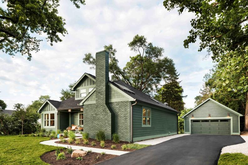 A driveway leads from the street to the home’s detached garage, with an unexpected lounge area with serious style inside.