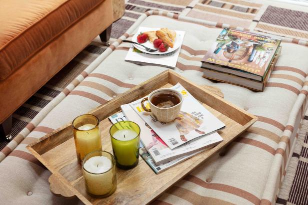 The living room offers the perfect place to enjoy some downtime, or catch up with friends. A carved wood tray with your favorite hot beverage, a few magazines, tasty snack, and a couple candles are all you need for a relaxing day at home. 
