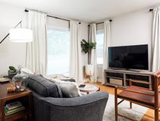 This living room in a rental was stylishly updated for remote work and children's play.