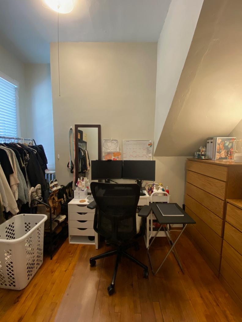 Hanging clothes, a work desk and even hair products crowded this closet.