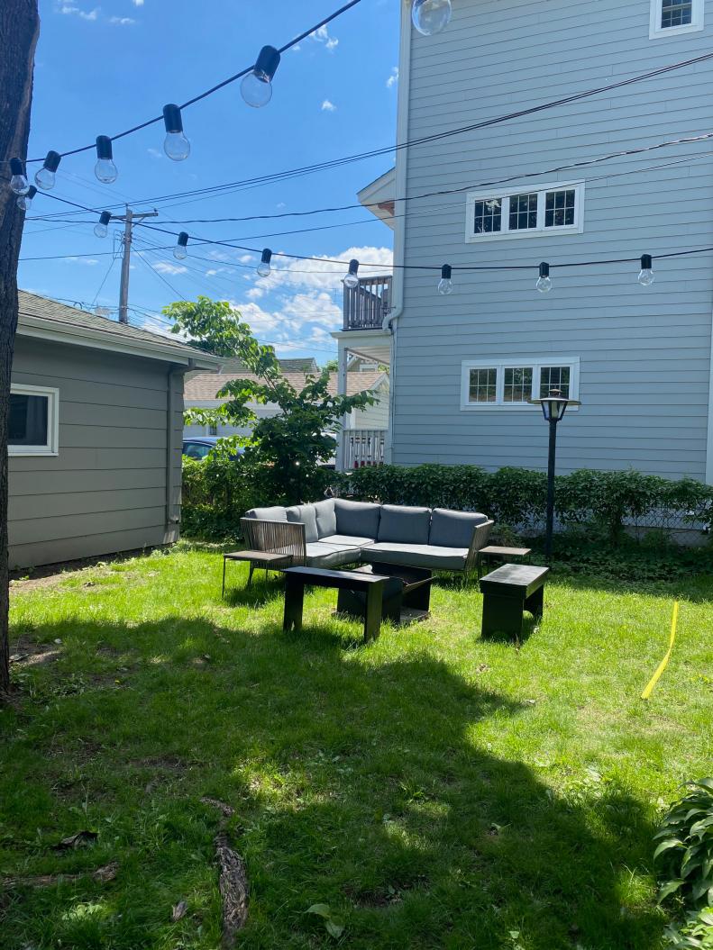 Uneven ground, misplaced lighting and outdoor furniture in need of a good arrangement left this patio area in need of a makeover.