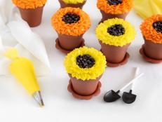 Fall and sunflowers go hand-in-hand, so whip up a batch of these blooming beauties for your next autumn-themed party. Sunflower petals are easily created using a leaf decorator piping tip, while mini flowerpots serve as playful containers for the delicious cupcakes.