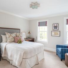 Transitional Neutral Bedroom With Blue Plaid Armchair