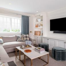 Transitional Media Room With Blue Ottomans