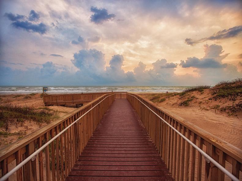 A wooden boardwalk leading to the beach at South Padre Island
