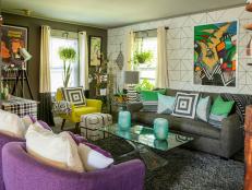 Geometric Pillows and Art in Living Room With Sofa Colorful Armchairs 