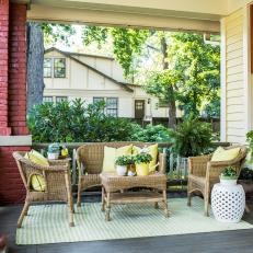 Porch Sitting Area With Yellow Pillows
