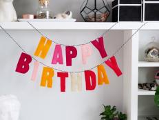 Felt letter banner spelling "Happy birthday"