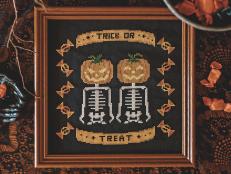 Cross-Stitched Pumpkin Heads on Skeleton Bodies, Reads Trick or Treat