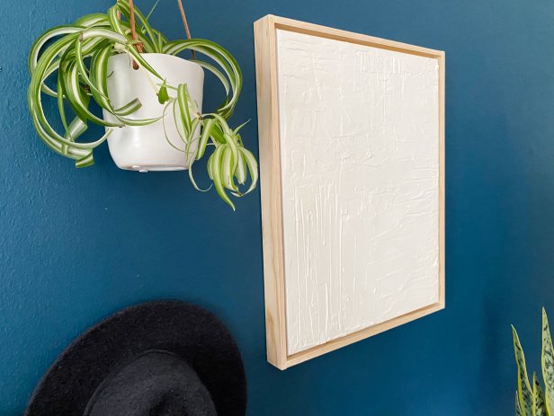 Wipe off any excess sawdust with a dry cloth. Add a hanging kit to the back and hang! Tip: Make it your own, by painting or staining the frame.