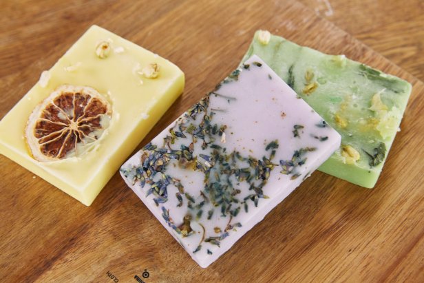 Handmade Melt-and-Pour Soaps on Table With Dried Lemon, Lavender