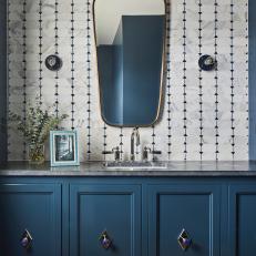 A Marble Mosaic Wall with Shiny Accent Tiles Elevates This Bathroom 