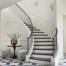 A Grand Curved Staircase Brings Art Deco Vibes to this New Build House