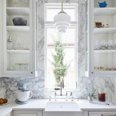 A Pendant Light and Marble Backsplash Adds an Art Deco Touch to This Butlers Pantry