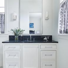 Bright White and Black Marble Bathroom with Large Mirror