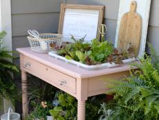 An upcycled table becomes a garden for growing greens.