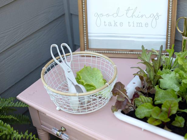 An upcycled table becomes a garden for growing greens.