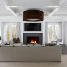 White Modern Living Room With Gray Fireplace