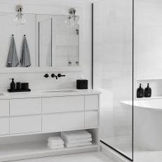 White Modern Spa Bathroom With Black Toiletries