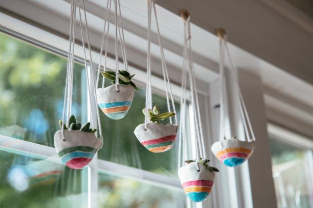 Add a tiny succulent and a bit of sandy potting soil (Image 1). Water by misting regularly. Hang in a window without a lot of direct light where they’ll add a little cheer all year long.
