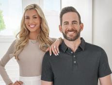 Host Tarek El Moussa (right) and Heather Rae Young (left) stop by their Newport Beach, CA home to check on the renovation progress.