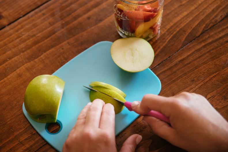 Cutting an Apple for a Camping Sangria Recipe