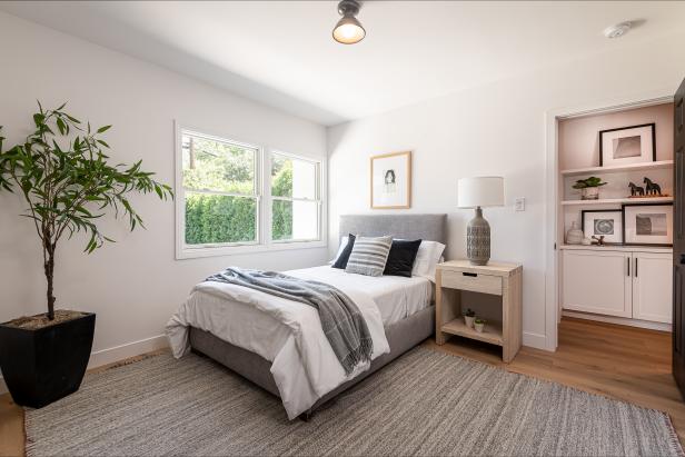 Neutral White Bedroom with Bold Black Door | HGTV