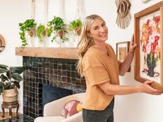 As seen on HGTV’s Help! I Wrecked My House, host Jasmine Roth puts the finishing touches in the Cates family's new living room (Dressing Living Room).