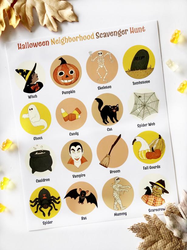 Flat Lay of Printed Halloween Scavenger Hunt Page Featuring Leaves, Candy, Pumpkins, Bats, Broomsticks and More