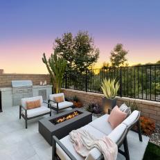 Contemporary Backyard with Grill and Seating Area