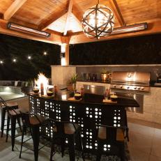 Brown Outdoor Kitchen With Illuminated Island