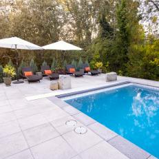 Pool and Patio With White Umbrellas
