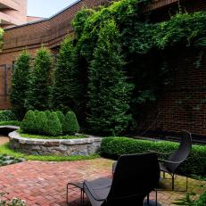 Brick Courtyard With Boxwoods