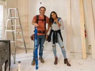 Hosts Taniya Nayak and Matt Blashaw discuss the wood that will become vertical shiplap in the kitchen of Seanna Crosbie’s renovation, as seen on HGTV's Pay it Forward, season 1.