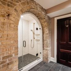 Bathroom With Brick Arched Shower