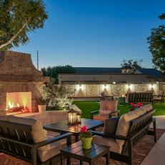 Spacious Backyard with Fireplace and Multiple Sitting Areas
