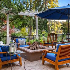 Patio with Blue and Wooden Outdoor Furniture